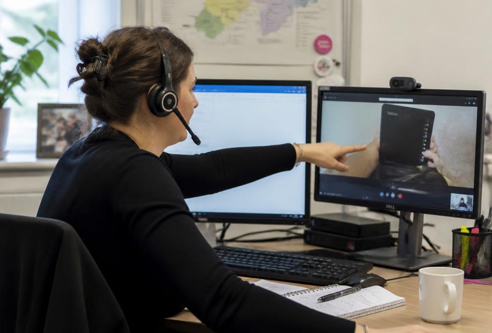 Coordinator guiding a customer through checks over live video